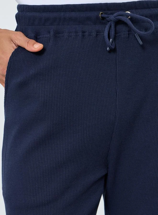 Styli Men Navy Blue Textured Waffle Knit Joggers